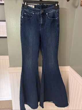 We the Free Dark Indigo Super Flared Wide-Leg Jeans with lace up back detail